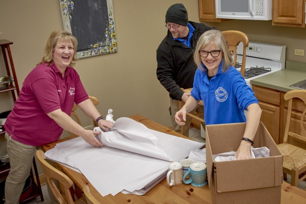 Movers packing fragile items